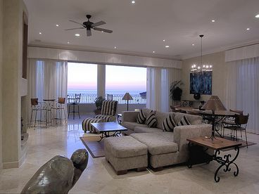 Opens to deck/balconies with sweeping views  from two seperate entrances.  Panorama view windows.  Entertainment center. Artwork.  Sleeper sofa sleeps 2 adults, or 3 small children.  Livingroom has an attached bathroom with shower.