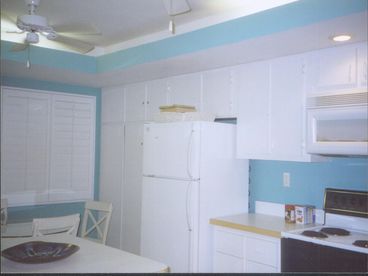Fully equipped eat-in kitchen.