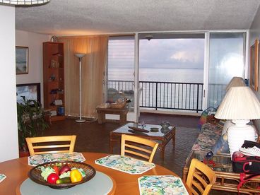 dinning, living area with full balcony beachfront ( colors at sunset )