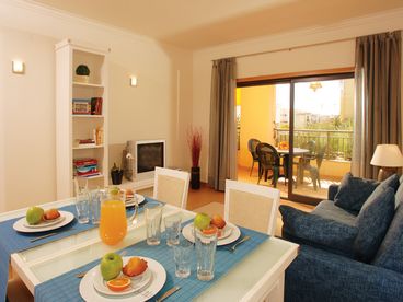 Generous dining/living area with cable TV, sofa bed, air-conditioning, electric shutters and direct access to terrace