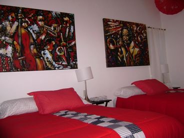 Upstairs bedroom, two queen beds, complete bath, safe deposit box