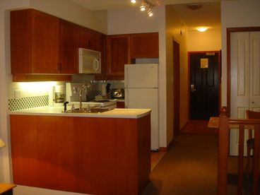 Full kitchen.  Stove, refrigerator, microwave, coffee maker with complete dishes and utensils.