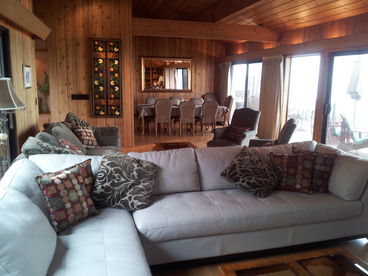 2 large seating areas, this one facing the HDTV on the north end of the living room, and facing the gorgeous waves. Behind is a second extra large sofa and chairs facing waves