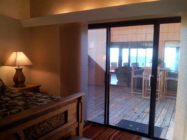 The huge master bedroom has ocean views across the courtyard/living room. The courtyard locks off, so you can leave the sliding door open at night, sleep to the sounds of waves!
