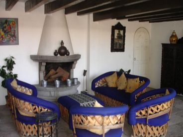 Living room furnished with typical equipales.