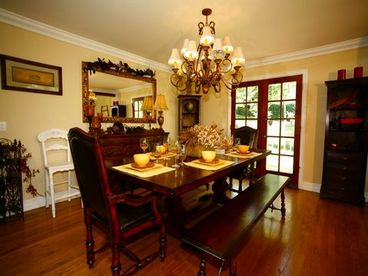 Elegant Dining area with bench seating and access outside deck. 