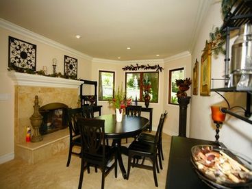 Dining area with fireplace opposite of Kitchen. Seats six comfortably. 