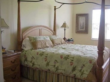 Master bedroom suite, with king bed opens to full bathroom with shower, soaker tub, and walk-in closets.