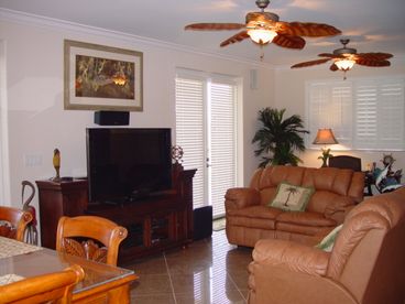 Living Room, leather couches, dining area, plasma tv , entertainment center, stereo and surrond sound