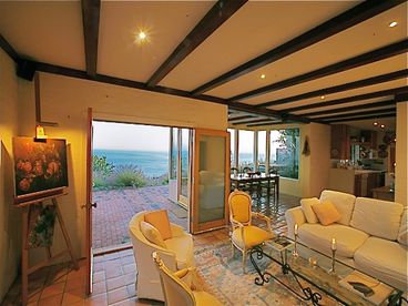 Living room with superb sunrise to sunset ocean view