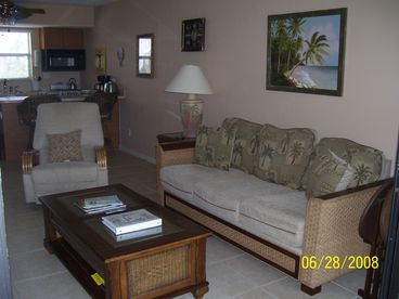 Living room features full size sofa and recliner lounge chair