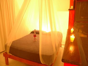 The studios each have a comfortable queen size bed divided from the rest of the room with a semi- wall