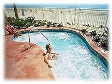 Outdoor hot tub facing the ocean and beach