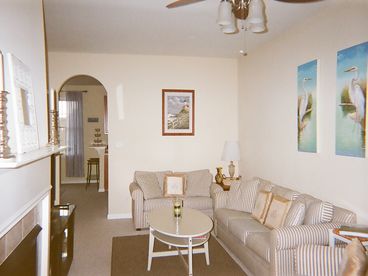 Living Room with game table, gas fireplace, flat screen tv, porch with view of golf course!
