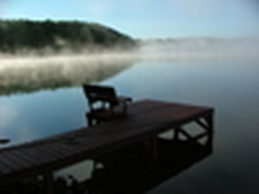 View of dock and secluded lake