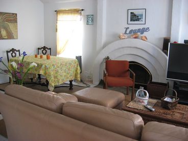 You can see our lovely fireplace, dining area, and the left half of the TV/entertainment system