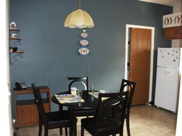 Full kitchen with microwave, garbage disposal, dishwasher. Laundry room access is located behind the pocket door.