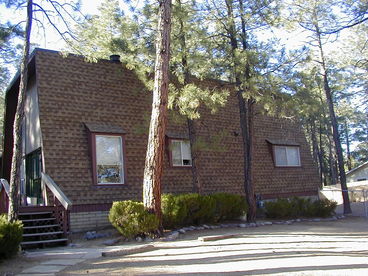 Side of cabin and parking area