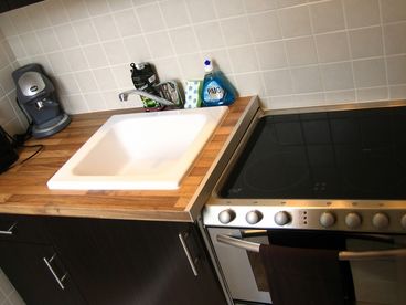 Kitchen with diswasher, stove and oven