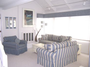 Living room with plenty of seating, TV/DVD and wireless internet access.