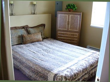 The bedroom contains a queensize bed and closet.  Sheets, comforter, and pillows are included.