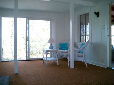 Living area with views to water -- now has new carpeting and sleeper sofa.