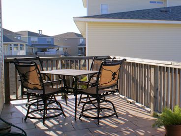 Bar height patio set with seating for 4 ~ enjoy terrific water views from the condos 2nd floor balcony.
