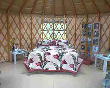 full size bed in yurt. 3 screened windows and a futon