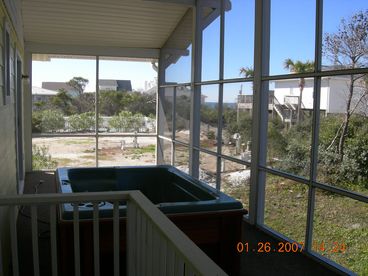 Screened porch with hot tub