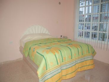 Nice and cozy bedroom, equipped  with queen beds as well with hammocks hangers