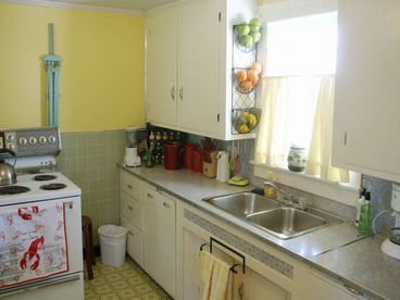For your convenience, the kitchen is fully stocked with stainless steel pots, pans, stock pots, baking dishes, mixing bowls, stemware, flatware, and dishes.  We\'ve also provided a few home-away-from-home luxuries like a toaster oven, fondue pot, and blender.  Finally, we provide spices, coffee, tea, creamers, coffee flavors, popcorn, sugar, flour, salt and pepper, bug spray, laundry detergant, and charcoal for all of our guests, free of charge.