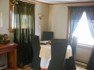 In addition to the kitchen, the home has a wonderful dining room with spectacular views over looking the bay.  The dining console table also converts into a gaming table, for rainy day family fun.