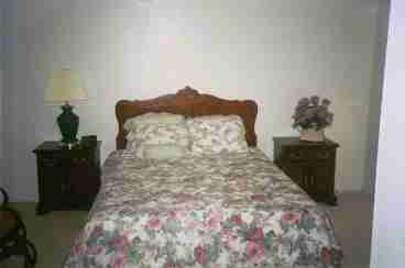 Queen Size Bed our large roomy Master Bedroom- it has a bathroom and a walk in closet, vanity sink area