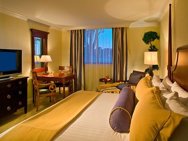 Deluxe room: Enjoy a 400 sq. ft. room offering two full-size beds or 1 king bed with down pillows and plush bedding, sitting area, breakfast table for two and luxurious marble bath with walk-in shower, tub and bidet.