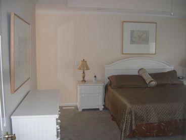 Spacious Master Bedroom with Tray Ceilings and King-sized bed