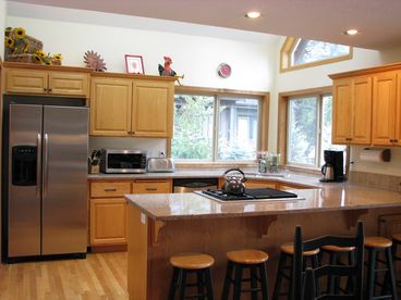Kitchen is fully equipped and has attached dining area with plenty of seating for everyone.