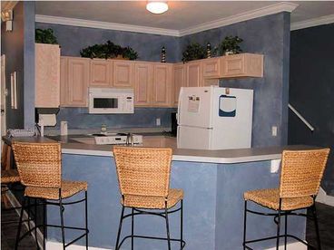 Open and spacious kitchen with breakfast bar!
