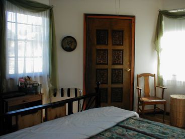 Bedroom of the small cabin has satellite TV, queen bed. Cabin has a small loft with  a sleeper sofa.