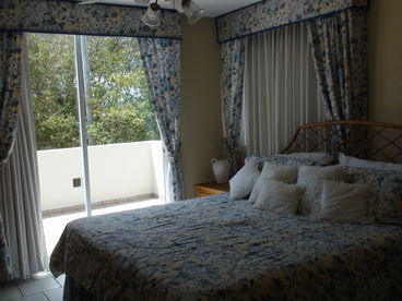 Master Bedroom, king size bed, looking to terrace to Hole #10 of Dorado del Mar Golf Course