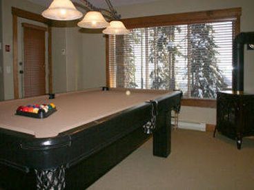 Rec room with pool table and wet bar.