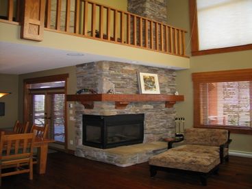 Gas fireplace between dining room and living room.