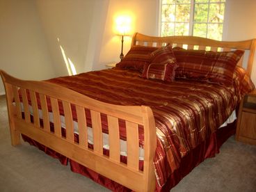 Master bedroom has a sleigh King bed, with beautiful comforters ... feel the luxury and elegance