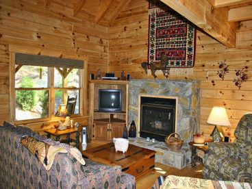 The cabin is set up with satellite television and a gas-log fireplace.