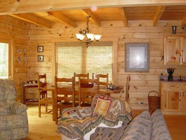 The dining area french doors lead to a deck complete with picnic table and gas grill.