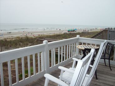 Rocking chairs and bistro set on back deck