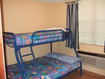 3rd Bedroom with a bunk bed, 1 full size bed and 1 twin.