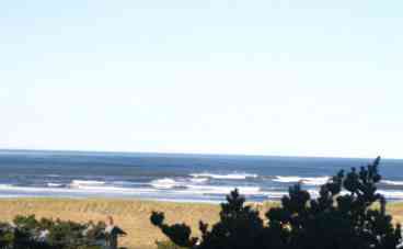 West facing view of Pacific Ocean from the living and kitchen areas of the condo and balcony.