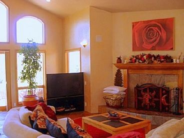 The living room has spectacular views directly facing red rock vista\'s and the famous Cathedral rock.relax and enjoy an open fire, or sink into the chenille oversized sofa\'s and watch a film on our huge screen t.v.