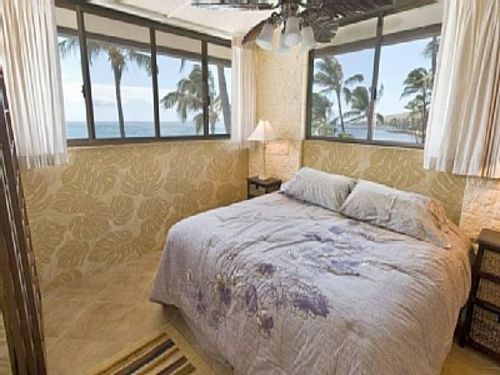 Bedroom is on the beach side of the condo. There are ocean views out of the two large windows. New king size bed. 
Let the sound of the waves lull you to sleep.