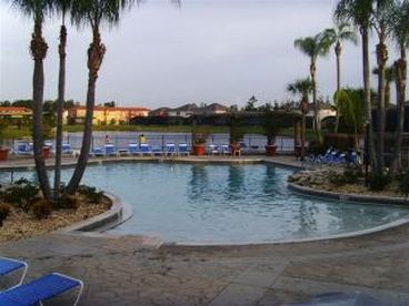 Walk in Heated Pool overlooking a Lake at the Resort Clubhouse.  Many other amenities including Beach Volleyball, Basketball Court, and childrens play area.